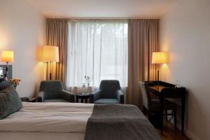 Postel nebo postele na pokoji v ubytování Elite Stadshotellet Västerås + 37 fotografií