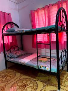 Postel nebo postele na pokoji v ubytování MDB Homestay