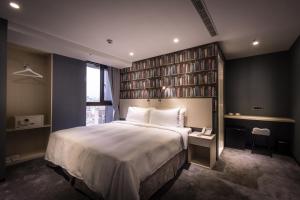 Postel nebo postele na pokoji v ubytování Yi Su Hotel-Taipei Ningxia