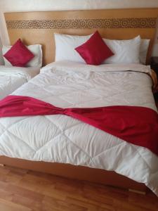 Katil atau katil-katil dalam bilik di Hotel Astoria Tanger