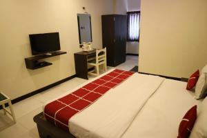 Hotel Sparkling Pearl客房内的一张或多张床位