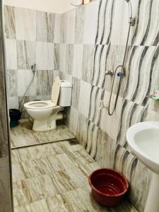 a bathroom with a toilet and a sink at Ameena Homestay in Tangalle +37 photos