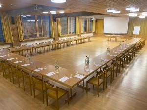 a large conference room with tables and chairs at Kloster Ilanz in Ilanz +17 photos
