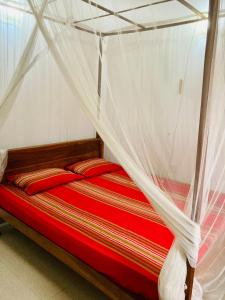 Postel nebo postele na pokoji v ubytování Ameena Homestay + 33 fotografií