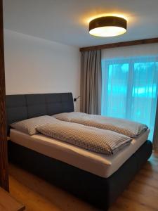 Ένα ή περισσότερα κρεβάτια σε δωμάτιο στο Rainerhof Apartment 4