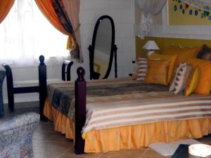 a bedroom with a large bed with a large mirror at The Legend Garden Condos in Saint Peter