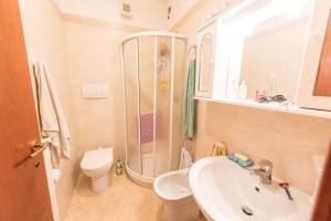a bathroom with a sink and a toilet and a shower at Casa Le Pleiadi in Montesilvano Marina
