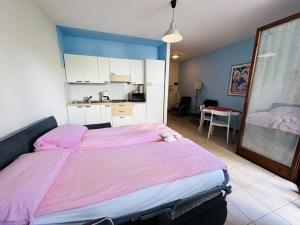 A bed or beds in a room at Apartment Alberto