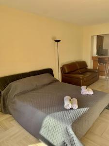 a bedroom with a bed with two towels on it at Gray d'Albion POL519 studio in Cannes