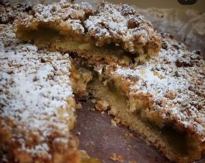 a close up of a cake with powdered sugar on it at Tenuta Vitale - Azienda agricola multifunzionale in Montoro Inferiore