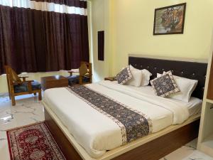 Ένα ή περισσότερα κρεβάτια σε δωμάτιο στο The Comfort Home Stay Ranthambhore