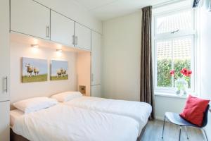 Postel nebo postele na pokoji v ubytování Staetige Dames