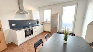 Kuchyň nebo kuchyňský kout v ubytování Vollausgestattete Monteurunterkunft mit WIFI & Dachterrasse