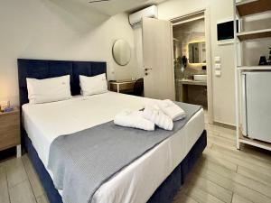 Krevet ili kreveti u jedinici u objektu PORTO PORTES suites