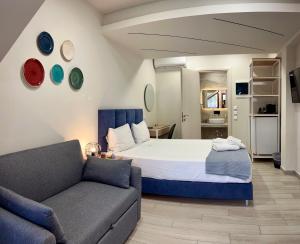 Krevet ili kreveti u jedinici u objektu PORTO PORTES suites