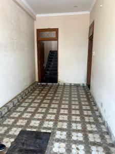 an empty room with a staircase and a door at Home near Holy Mahakumbh in Prayagraj