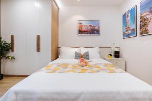 Postel nebo postele na pokoji v ubytování Margaery Apartment Tu Hoa Princess