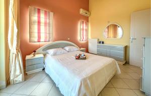 a bedroom with a bed with a toy truck on it at 3 Bedroom Nice Home In Xylokastro in Xylokastron