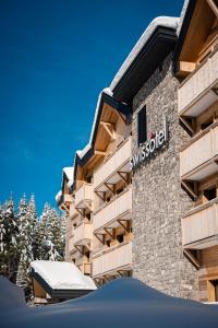 a building with the swarovski sign on it at Swissôtel Resort Kolasin in Kolašin
