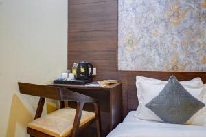 Postel nebo postele na pokoji v ubytování Shyama inn by Rivlet