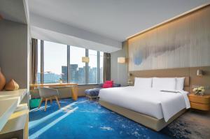 Postel nebo postele na pokoji v ubytování Le Meridien Hangzhou, Binjiang