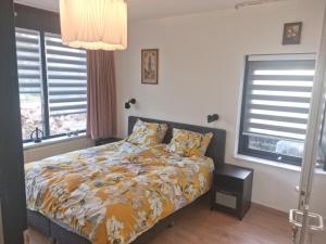 Postel nebo postele na pokoji v ubytování B&B Harskamp