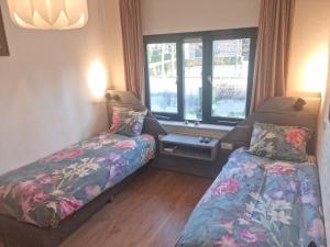 Postel nebo postele na pokoji v ubytování B&B Harskamp