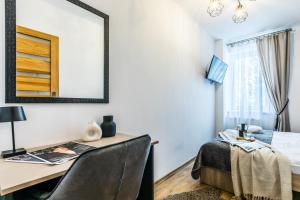 Posteľ alebo postele v izbe v ubytovaní Apartament Piaseckiego Centrum