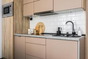 Kuchyňa alebo kuchynka v ubytovaní Apartament Piaseckiego Centrum