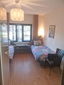 Postel nebo postele na pokoji v ubytování B&B Harskamp