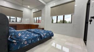 Ένα ή περισσότερα κρεβάτια σε δωμάτιο στο Chun Zhi Yen Homestay +35 φωτογραφίες