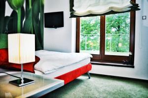 Postel nebo postele na pokoji v ubytování Design Hotel Romantick