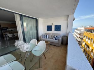 a living room with a couch and a table and chairs at Casa Eva in Los Llanos de Aridane