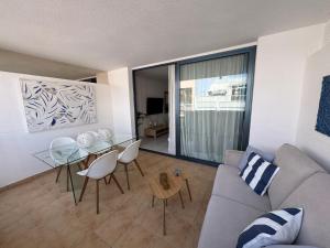 a living room with a couch and a glass table at Casa Eva in Los Llanos de Aridane