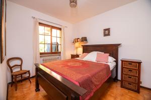 Ένα ή περισσότερα κρεβάτια σε δωμάτιο στο Casa Claudia, a due passi da lago e spiaggia