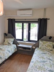 Postel nebo postele na pokoji v ubytování B&B Harskamp