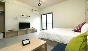 TV a/nebo společenská místnost v ubytování Happiness 210 B&B