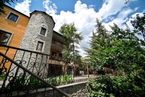 a building with a fence in front of it at Villa Dudu, Luxury Villa in Hankavan in Hankʼavan