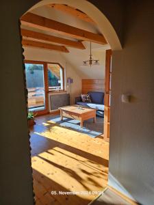 a living room with a couch and a table at Ferienhaus Lipowa in Lipowa