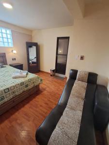 Postel nebo postele na pokoji v ubytování Hostal Nichkito