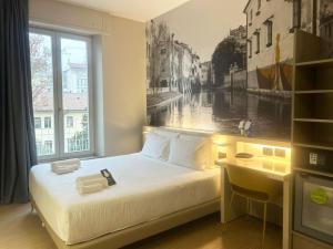 Postel nebo postele na pokoji v ubytování B&B Hotel Treviso