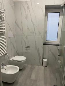 a bathroom with a toilet and a sink at Agriresort Landscape in Ercolano