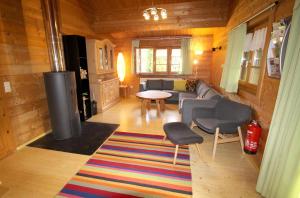 a living room with a couch and a table at Ferienhaus Donau 31 Glückskäfer in Hayingen