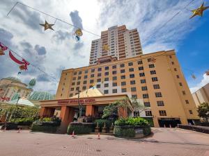 a building with kites flying in front of it at Sunway Resort Suite #29 1- 6paxs Sunway Lagoon Pyramid in Petaling Jaya