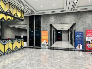 a lobby with black doors and yellow and black walls at Shah Alam Alinea Linata Studio Seksyen 14 in Shah Alam +16 photos
