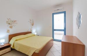 Postel nebo postele na pokoji v ubytování Donna Sandra casa vacanze