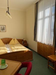 Postel nebo postele na pokoji v ubytování Donau-Rad-Hotel Wachauerhof