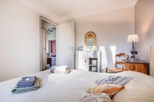 Katil atau katil-katil dalam bilik di Petite maison à la campagne
