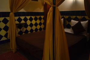Postel nebo postele na pokoji v ubytování Riad Hôtel Belleville Marrakech