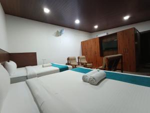 TV a/nebo společenská místnost v ubytování Jungle Hill Resort Coorg